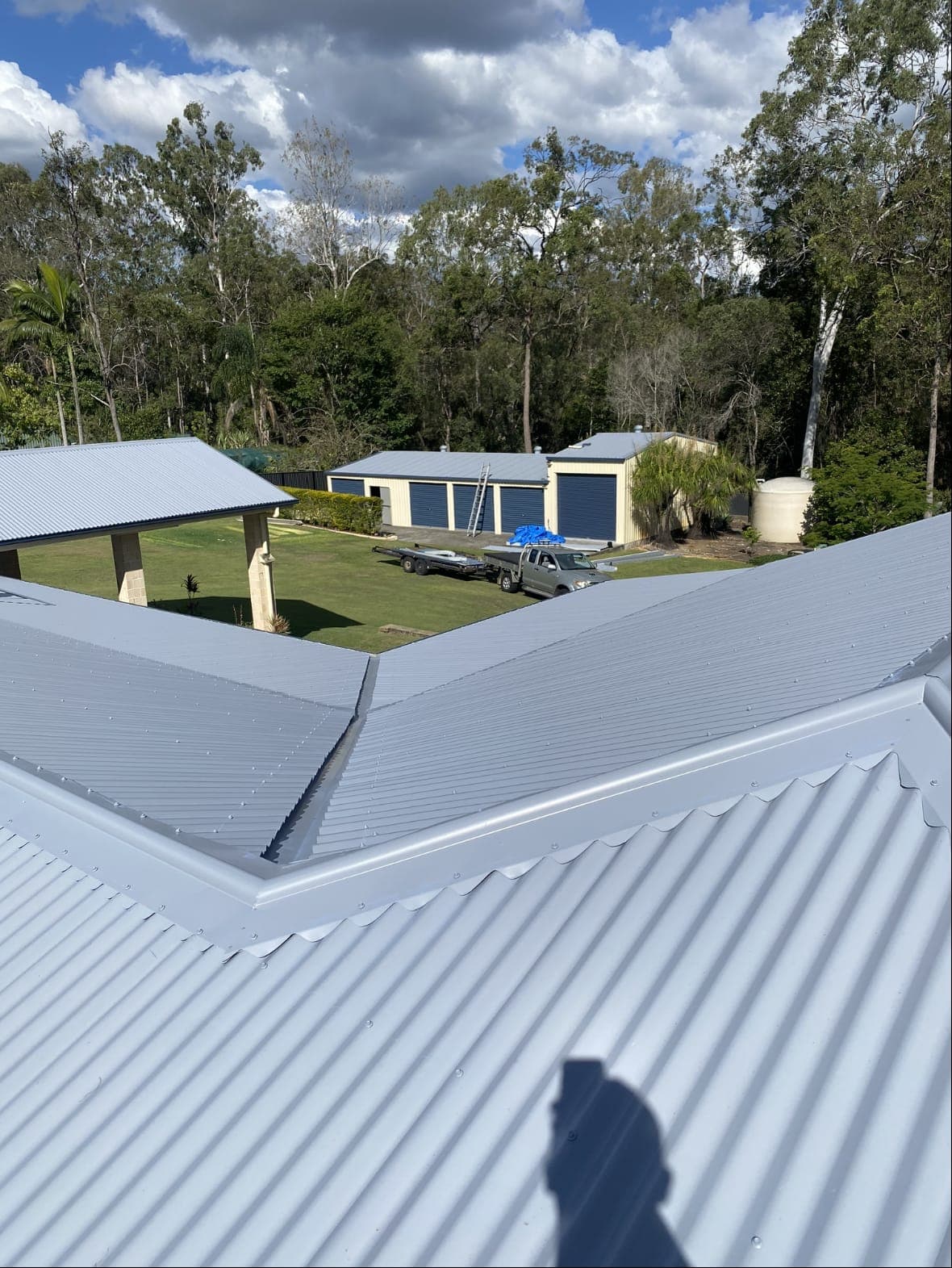 New light grey Colorbond roof with a valley and ridge capping